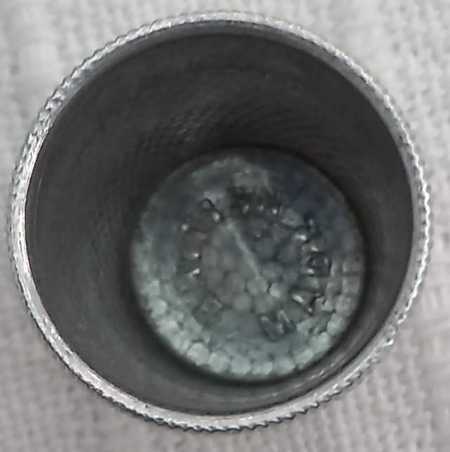 A stunning close-up of a textured vintage thimble, highlighting its unique design and the artistry involved in its creation