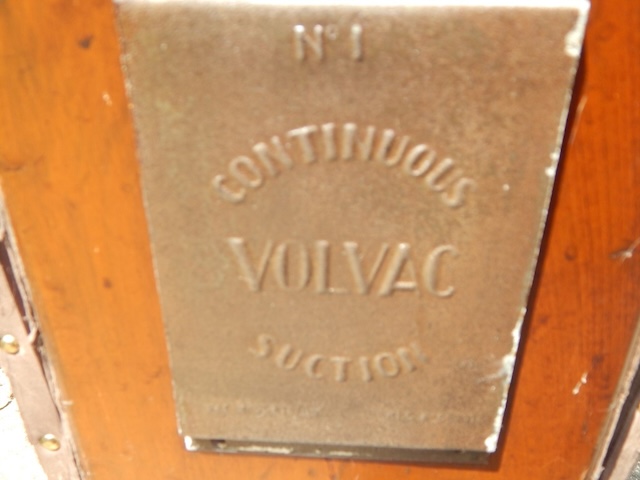 A close-up of the front branding plate that reads "Volvac Continuous Suction," highlighting the unique features that made this vacuum a technological marvel of its time