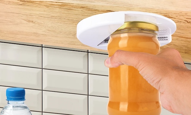 A versatile under-cabinet jar opener, perfect for saving counter space and effortlessly opening jars of all sizes