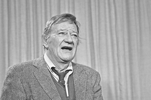 A candid shot of John Wayne in his later years, offering a glimpse into his enduring legacy.