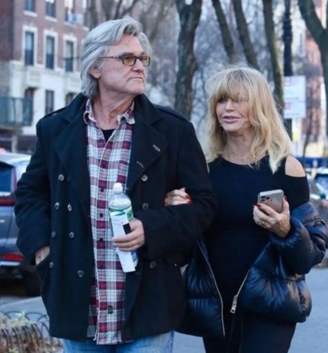 Goldie Hawn and long-time partner Kurt Russell enjoy a walk together, radiating warmth despite recent speculations about her altered appearance.