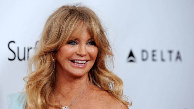 Goldie Hawn graces the red carpet with her radiant smile and effortless charm.