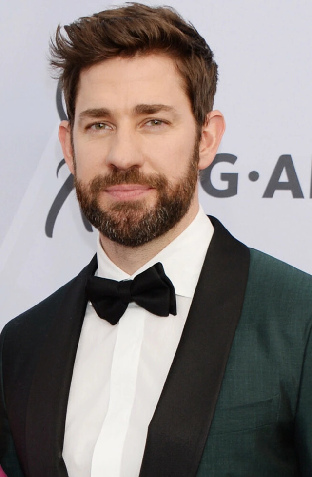 In a close-up shot, John Krasinski's sharp features and confident gaze underline his appeal as a leading man.