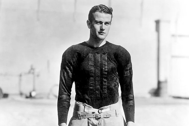 John Wayne as a football player, highlighting his early athletic pursuits before his Hollywood stardom.