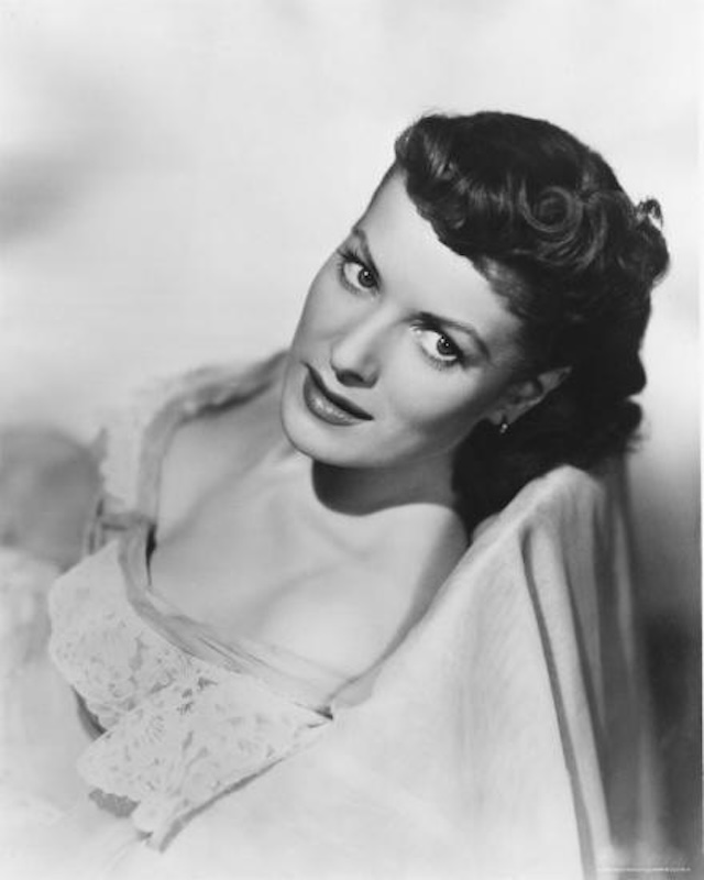 A youthful Maureen O'Hara with a soft yet commanding presence, showcasing the kind of classic beauty that made her a star of the silver screen