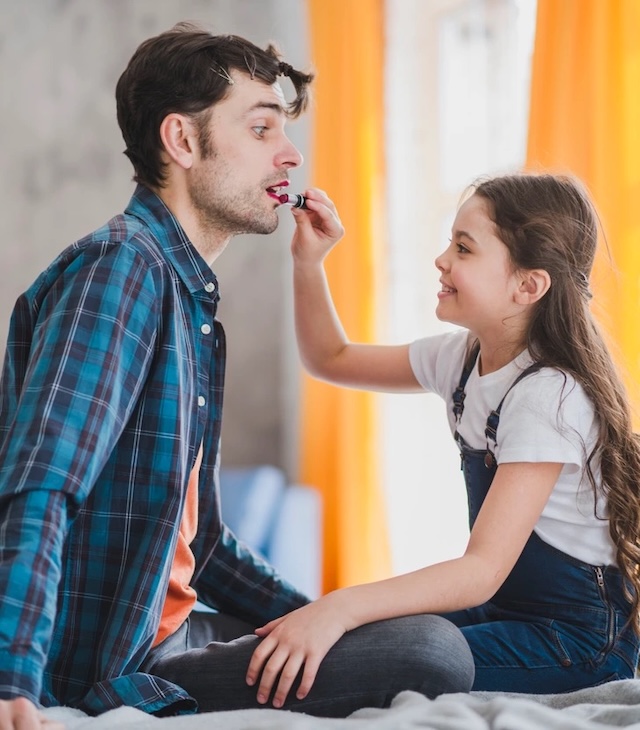 A playful bonding moment between father and daughter as they know each other well