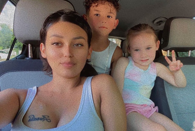  A candid moment of Erika and her kids in the car, capturing the warmth and joy of their time together