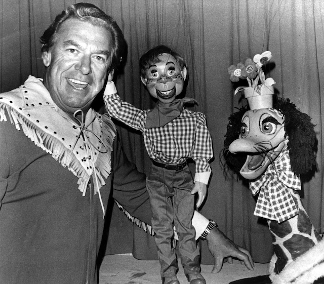 Buffalo Bob Smith alongside Howdy Doody and another puppet friend, a snapshot of the beloved cast that brought laughter and excitement to The Howdy Doody Show