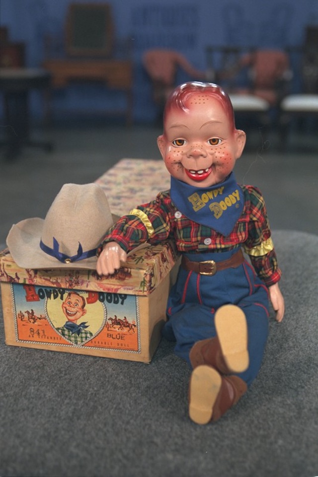 A collectible Howdy Doody marionette, perfectly preserved with its original box, evoking memories of childhood playtime and the magic of early television