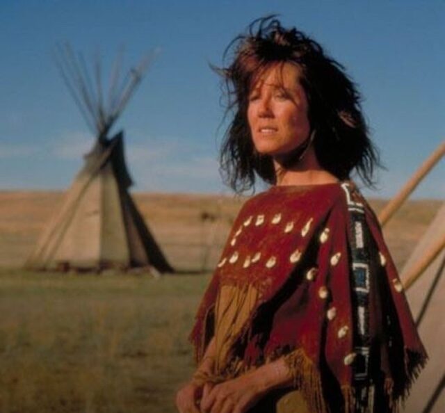 An emotional and pivotal moment from Dances with Wolves, portraying a key character holding a lifeless figure, illustrating the gravity of the scene