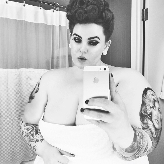 With a beaming smile, Tess Holliday shares her joy and encourages others to embrace their own beauty without fear or shame