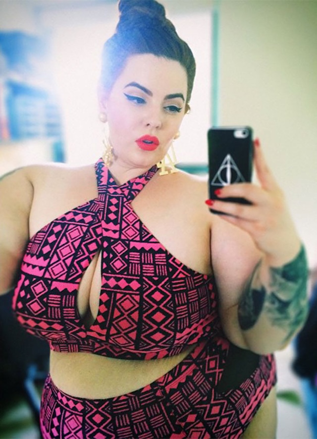 Tess Holliday confidently flaunts her curves in a side-profile shot, emphasizing the importance of self-love and acceptance