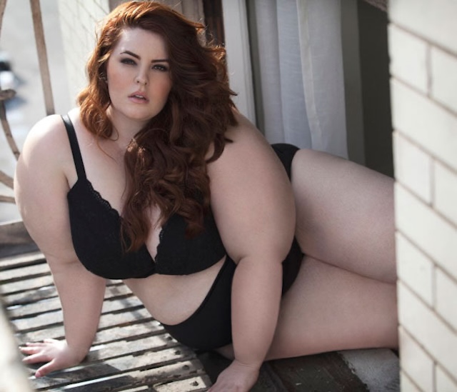 Tess Holliday exudes self-assurance in a striking black and orange dress, proving that beauty is all about self-expression