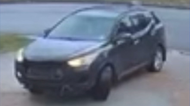 A blurry image from security footage shows the suspected getaway car, a critical clue in identifying the woman who broke into the home