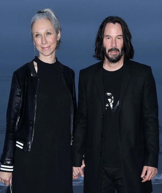 Keanu Reeves and Alexandra Grant look elegant together as they attend a seaside event, hand in hand