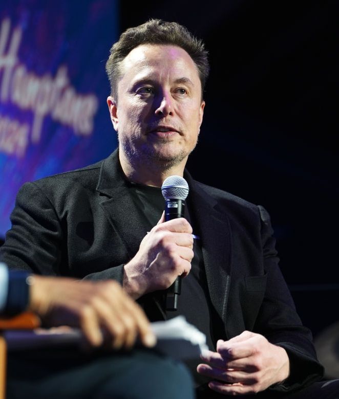 Tesla CEO Elon Musk addresses the audience, amidst the growing controversy surrounding Tesla's autopilot system and its involvement in a fatal crash