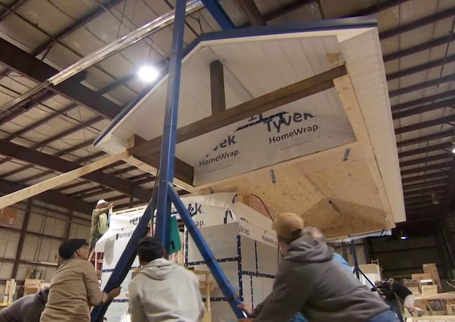 Workers in action building tiny homes for the 12 Neighbours community, a project aimed at providing affordable housing for the homeless