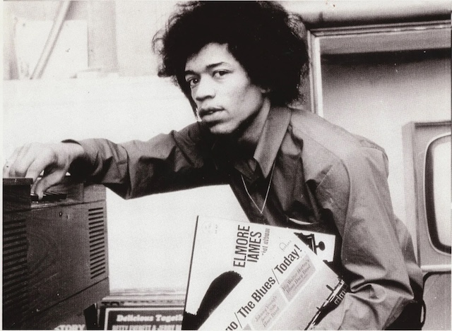 An iconic image of Jimi Hendrix looking thoughtfully at the camera, his expressive face reflecting the depth of his musical journey