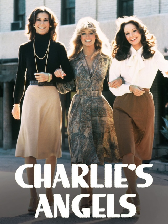 A famous moment from Charlie’s Angels with the trio dressed in iconic 1970s attire, celebrating the empowerment of women through their unique roles in crime-solving and combat