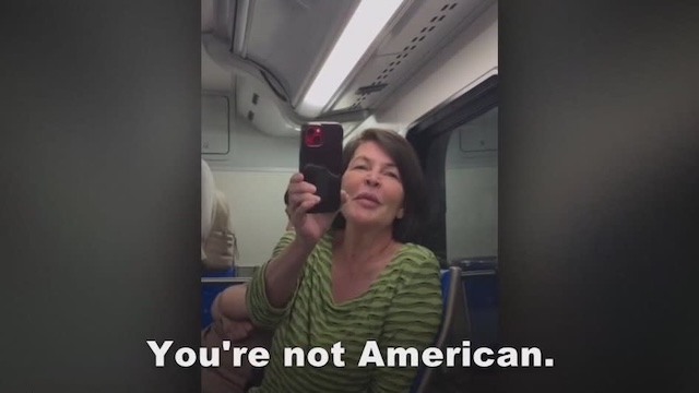 The woman in the image appears to be filming her own rant, claiming that the Indian-American family was disrespectful, while she filmed herself confronting them