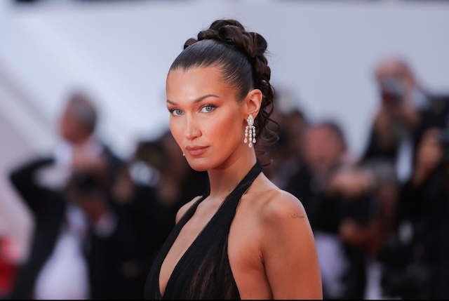 Bella Hadid commands attention with her striking appearance and bold style, making an unforgettable impact on the red carpet at the Venice Film Festival