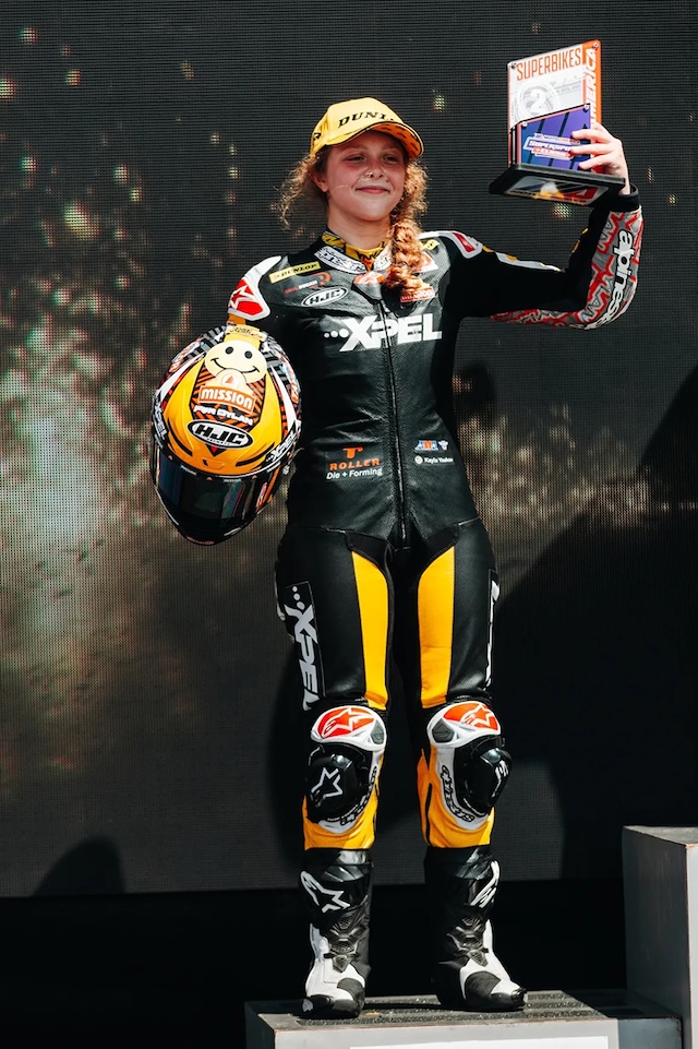 Kayla Yaakov stands proudly on the podium after another stellar finish in the MotoAmerica series, continuing to break barriers for young female racers