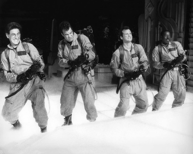 The team of Ghostbusters gearing up for a fight with the supernatural forces, ready to face whatever paranormal activities come their way with their iconic proton packs