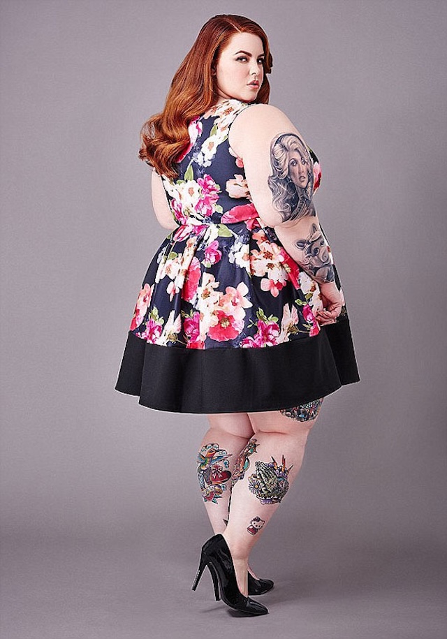 A captivating portrait of Tess Holliday, confidently sporting her curvy figure in a floral dress, embracing both her style and personality