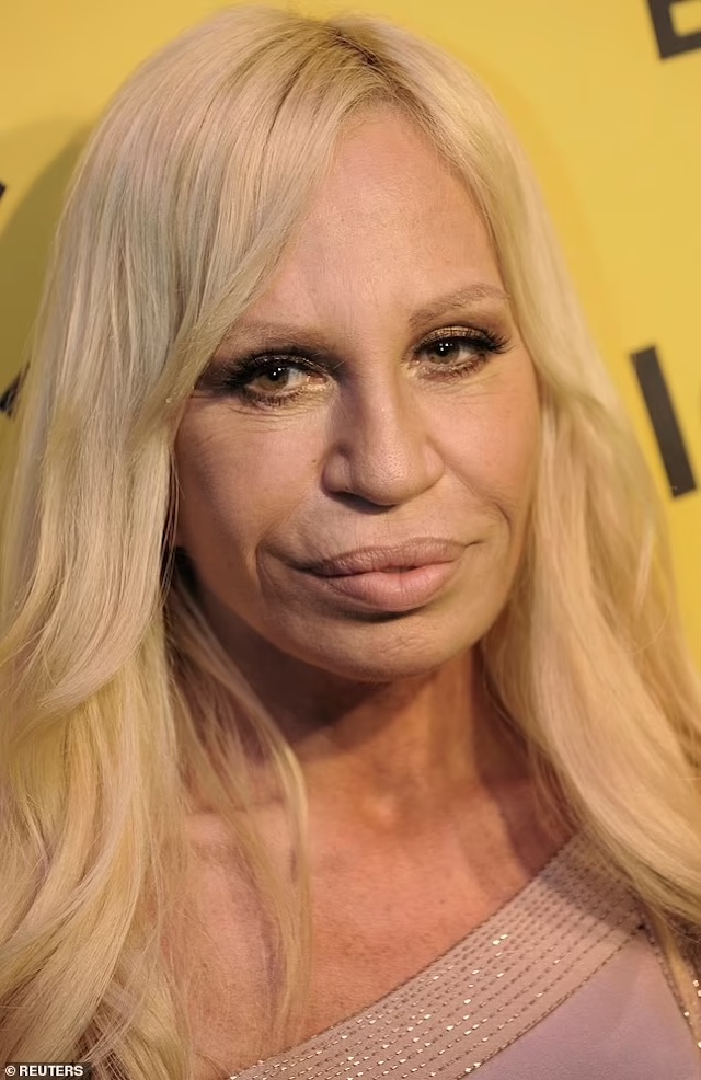  A sophisticated and striking photo of Donatella at a major fashion gala, showcasing her high fashion elegance