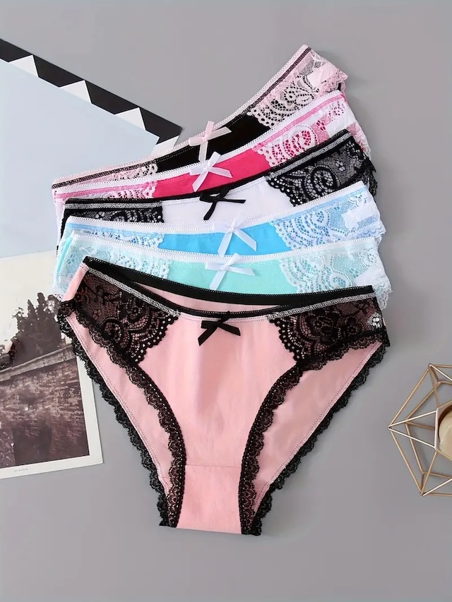 An arrangement of colorful underwear with lace details and dainty bows, highlighting the diversity in designs and tradition