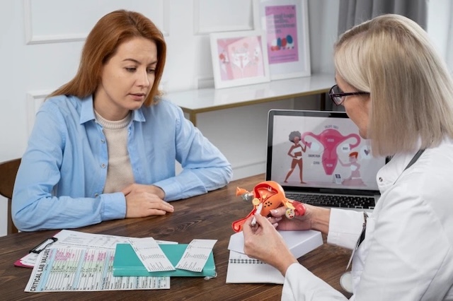 A woman consulting with a gynecologist highlights the link between gluten sensitivity and irregular menstrual cycles or hormonal disturbances