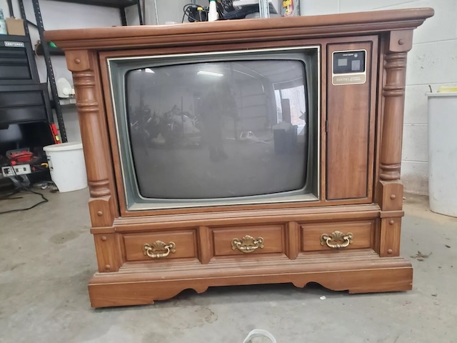 A beautiful wooden-cabinet vintage Zenith TV, once a centerpiece of living rooms, blending technology and furniture into a timeless design