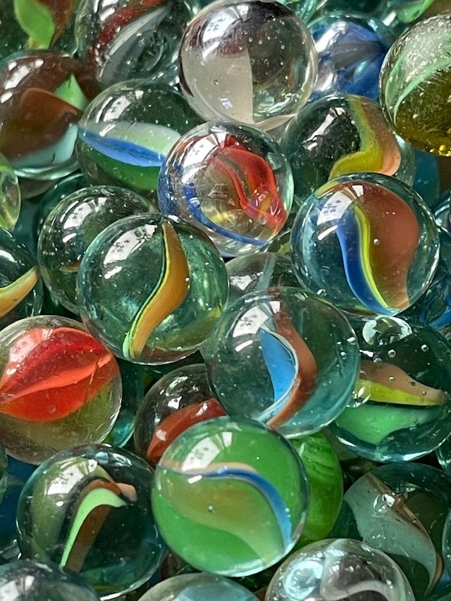 Marbles originated in Ancient Egypt, later evolving with glass production