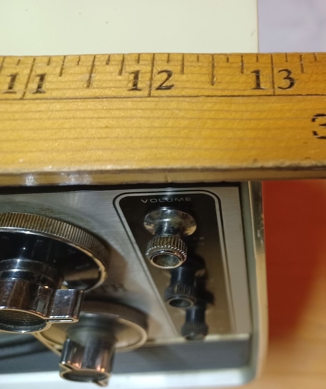 A ruler placed over the volume knob adds a touch of curiosity to this piece of television history