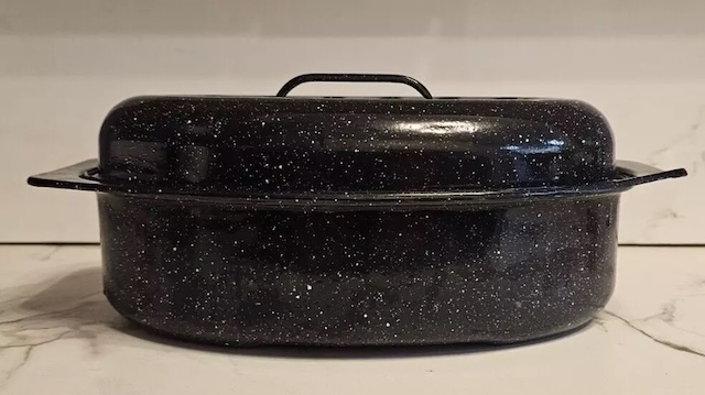 Side profile of the vintage enamelware roasting pan, emphasizing its timeless design and practicality for traditional cooking