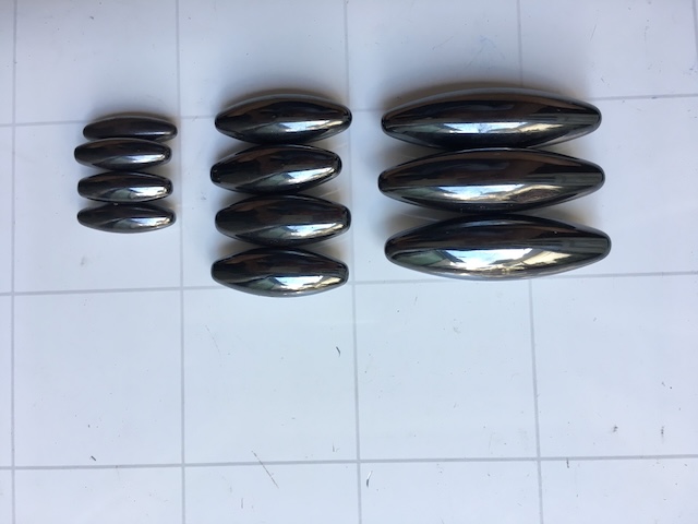 A lineup of sleek, oval ferrite magnets, ready for experiments, crafts, or just a fun playtime