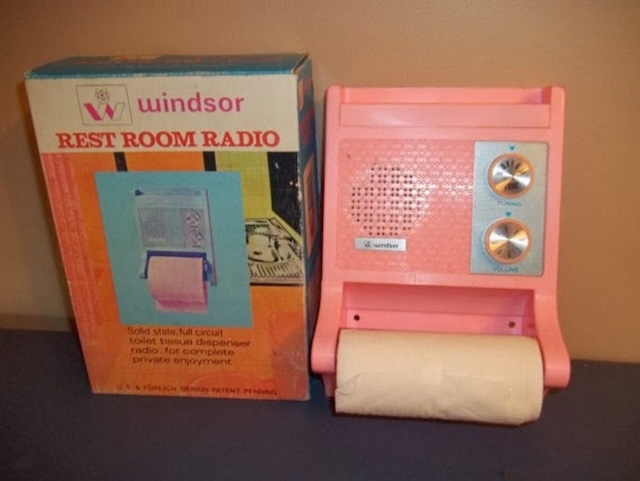 A Windsor brand restroom radio, complete with its original box, showcasing a vibrant pink finish and multifunctional design for entertaining and convenience.