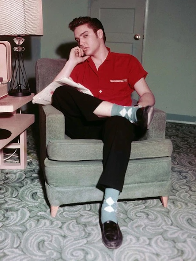 Elvis Presley sporting his signature style, complete with sleek loafers