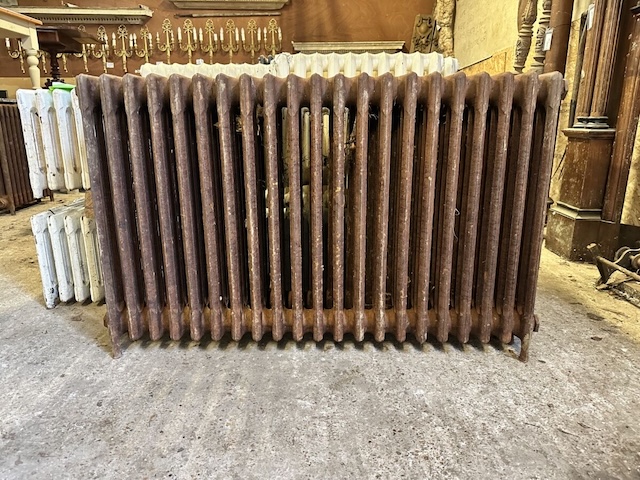 This well-worn vintage cast-iron radiator carries decades of history, warming homes and hearts through the years