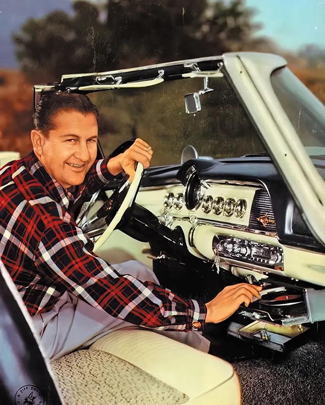 Lawrence Welk showcases a Highway Hi-Fi system in his 1956 Chrysler convertible