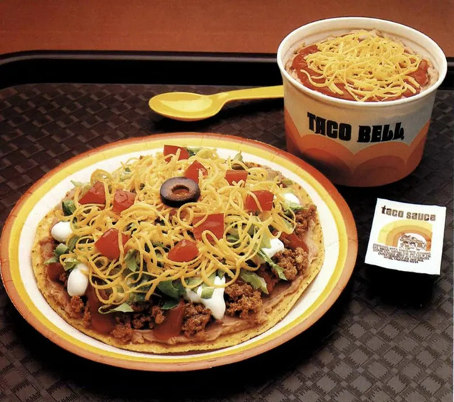 A Taco Bell meal from the 1970s, featuring a taco topped with cheese and paired with a refreshing drink. The colors and presentation evoke a nostalgic sense of the brand’s golden years.