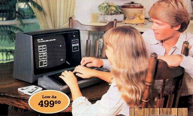 A father and daughter exploring their home computer, with a vintage price tag of $499.00, reflecting the growing appeal of personal computing in the late 1970s.