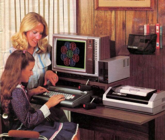 A mother and daughter in the 1980s enjoying their computer time, highlighting the early personal computers as family entertainment.