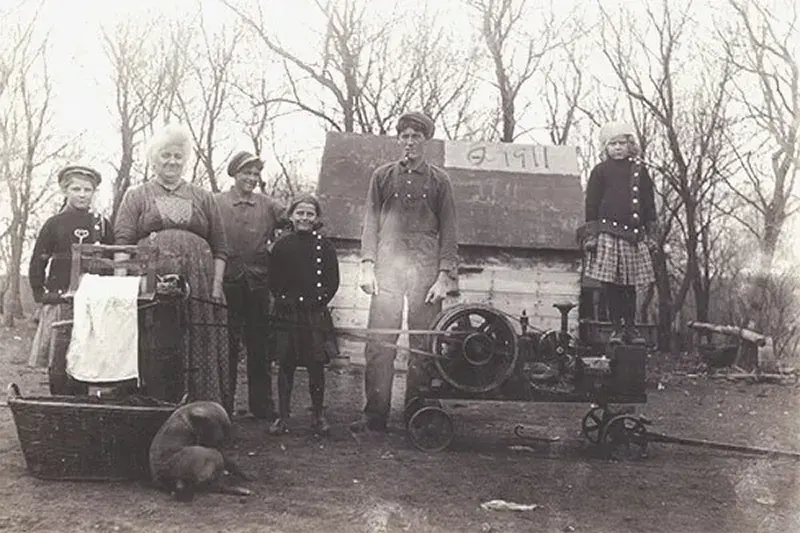 A Southern Ohio family proudly poses with their new washing machine, 1911.