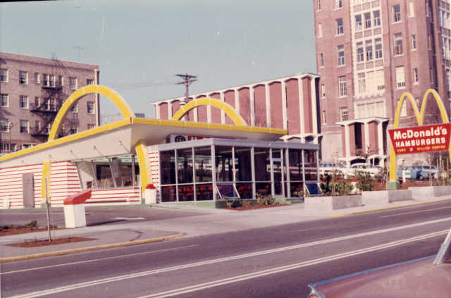 A bustling McDonald's location in Tacoma, Washington, 1967, serving up burgers, fries, and milkshakes.