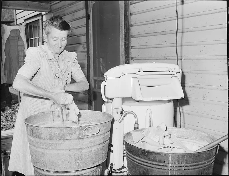 A miner’s wife tending to laundry on washday at the Bradshaw Mine, McDowell County, West Virginia, 1946.