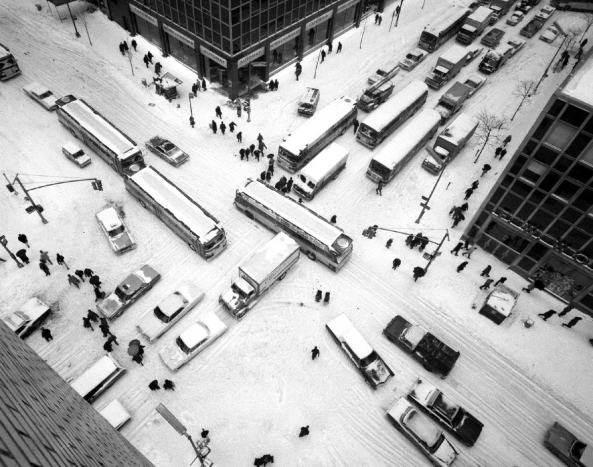 A sudden blizzard creates treacherous driving conditions near East 42nd Street, where fierce winds and a foot of snow bring traffic to a standstill, 1967.