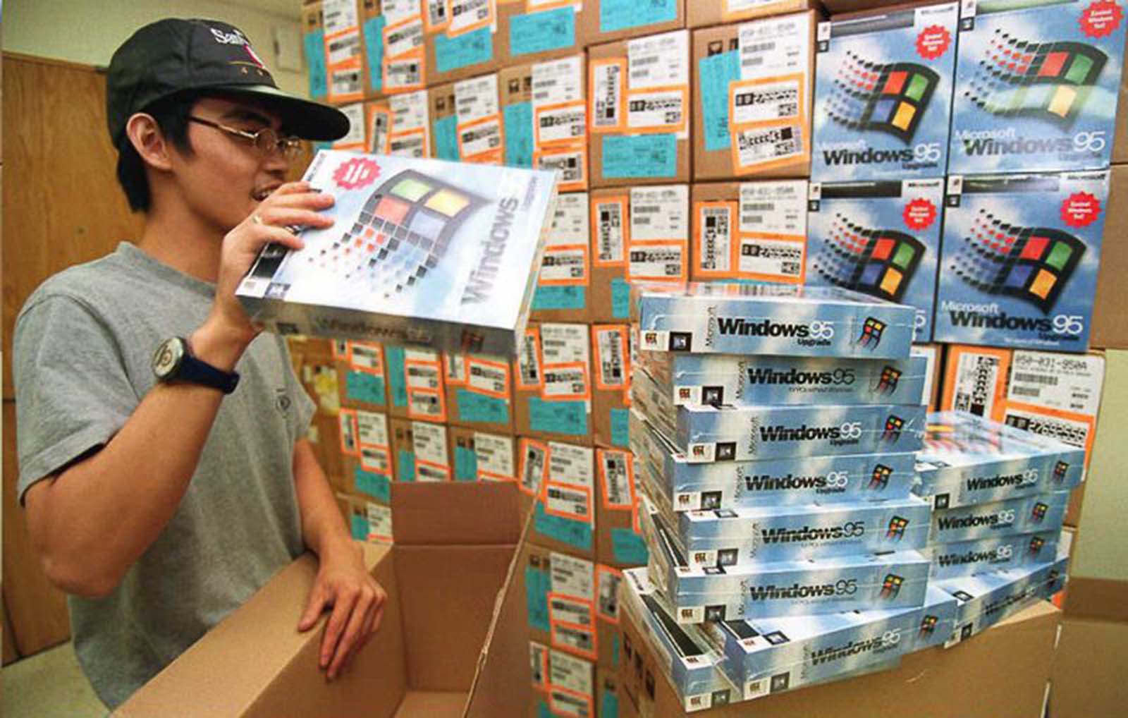 A wholesale distributor unpacks fresh copies of Windows 95, ready to hit the shelves in Hong Kong.