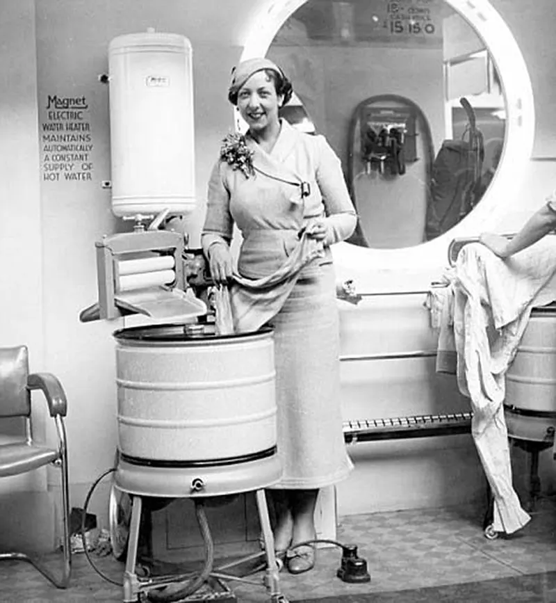 Actress Eileen Pollock, pictured with an electric washing machine at the 1935 Daily Mail Ideal Home Exhibition at Olympia.