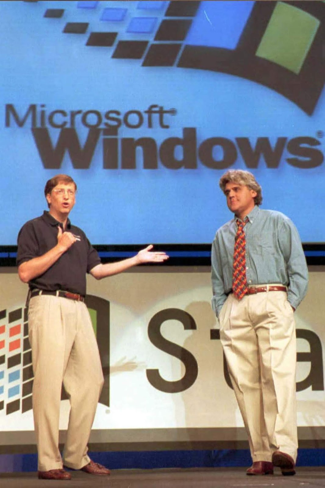 Bill Gates shares the stage with comedian Jay Leno at the high-energy Windows 95 kickoff event in Redmond, Washington.